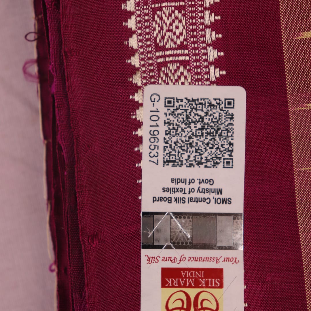 Close-up of plain cream and magenta Sambalpuri Silk Saree fabric texture.
