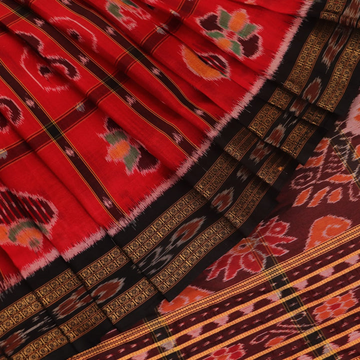 Red and black silk Khandua saree with Nabakothi pattern, styled or draped view showing the overall look.