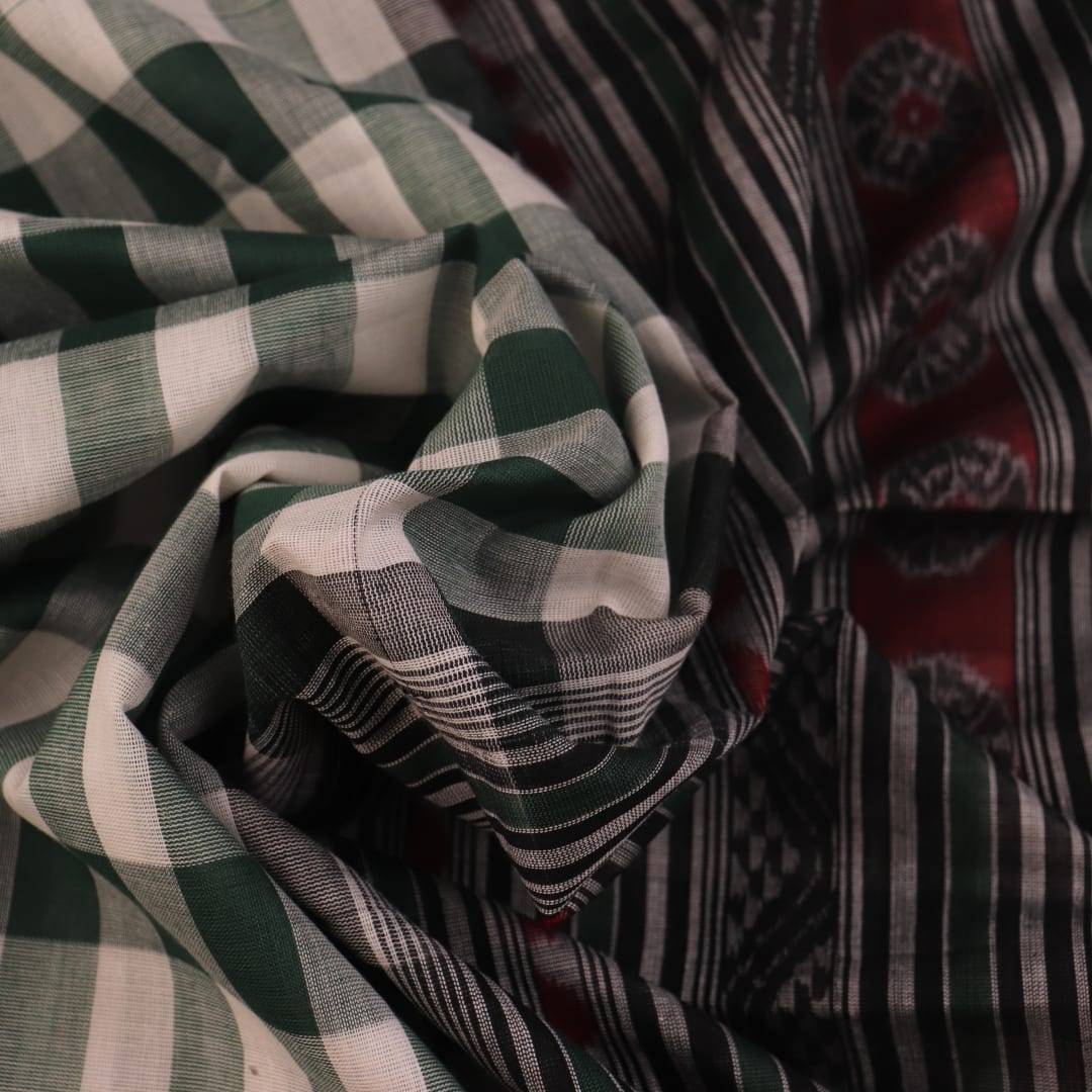 Full view of a green and black Sambalpuri cotton saree with motifs.