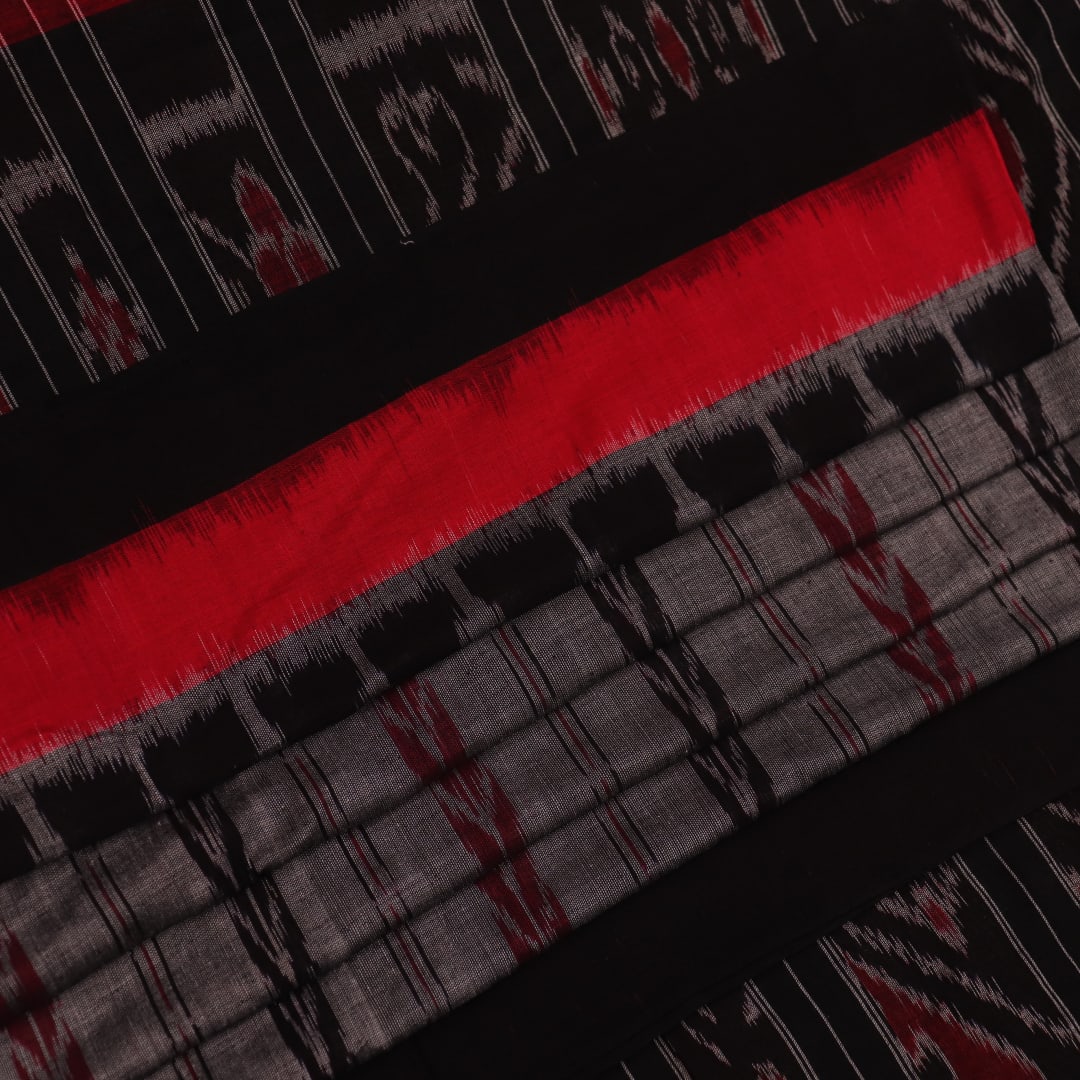 Grey and black Sambalpuri cotton saree draped, showcasing overall look and handloom texture.