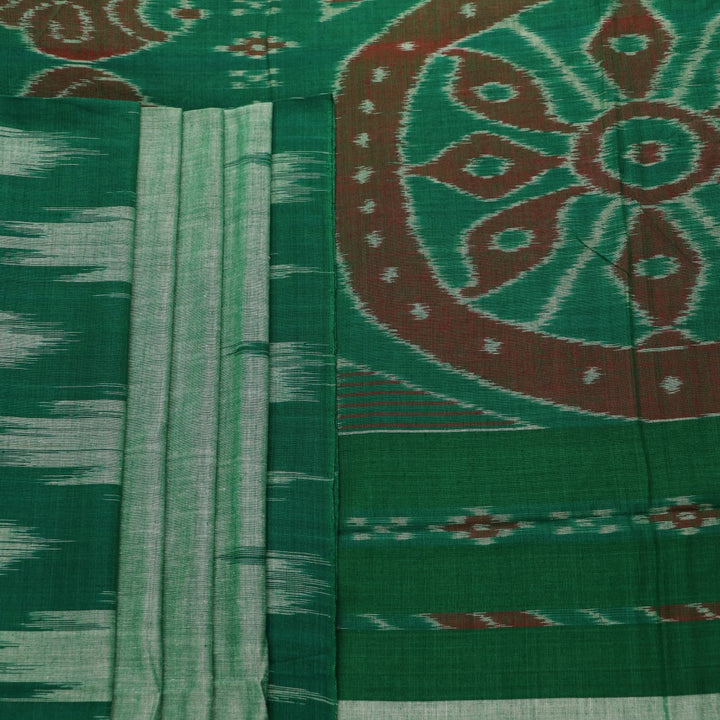 Model wearing a plain green Sambalpuri cotton saree, elegantly draped.