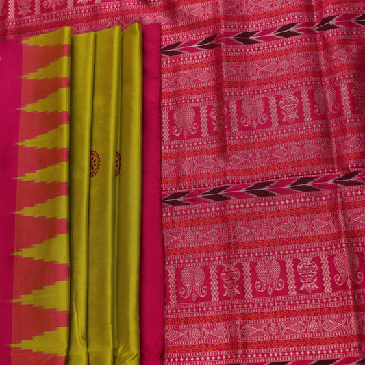 Close-up of green and magenta Bomkai silk saree fabric texture, highlighting intricate weave and butta pattern.