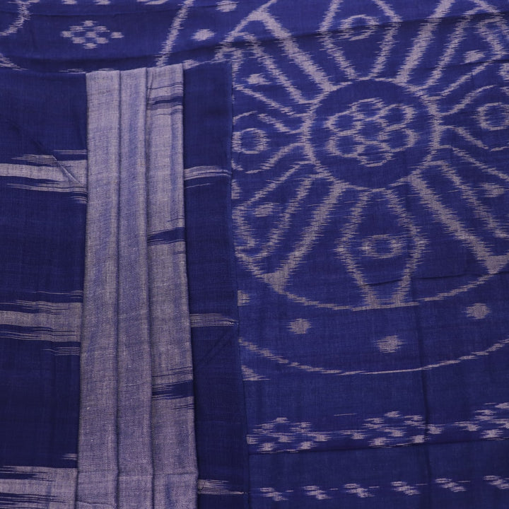 Blue plain Sambalpuri cotton saree styled, highlighting its simple elegance and drape.