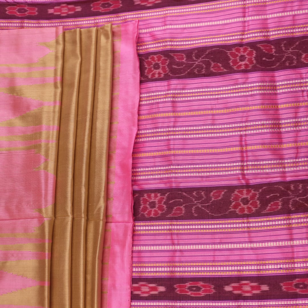 Close-up of green and pink plain Sambalpuri silk saree fabric texture.