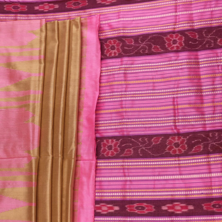 Close-up of green and pink plain Sambalpuri silk saree fabric texture.