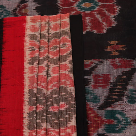 Styled cream Sambalpuri cotton saree with black motifs, highlighting its elegant drape and design.