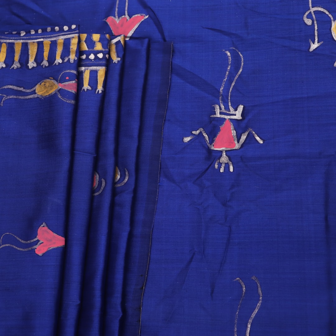 Close-up of handloom blue silk Patachitra saree, showcasing the detailed texture of the hand-painted fabric.
