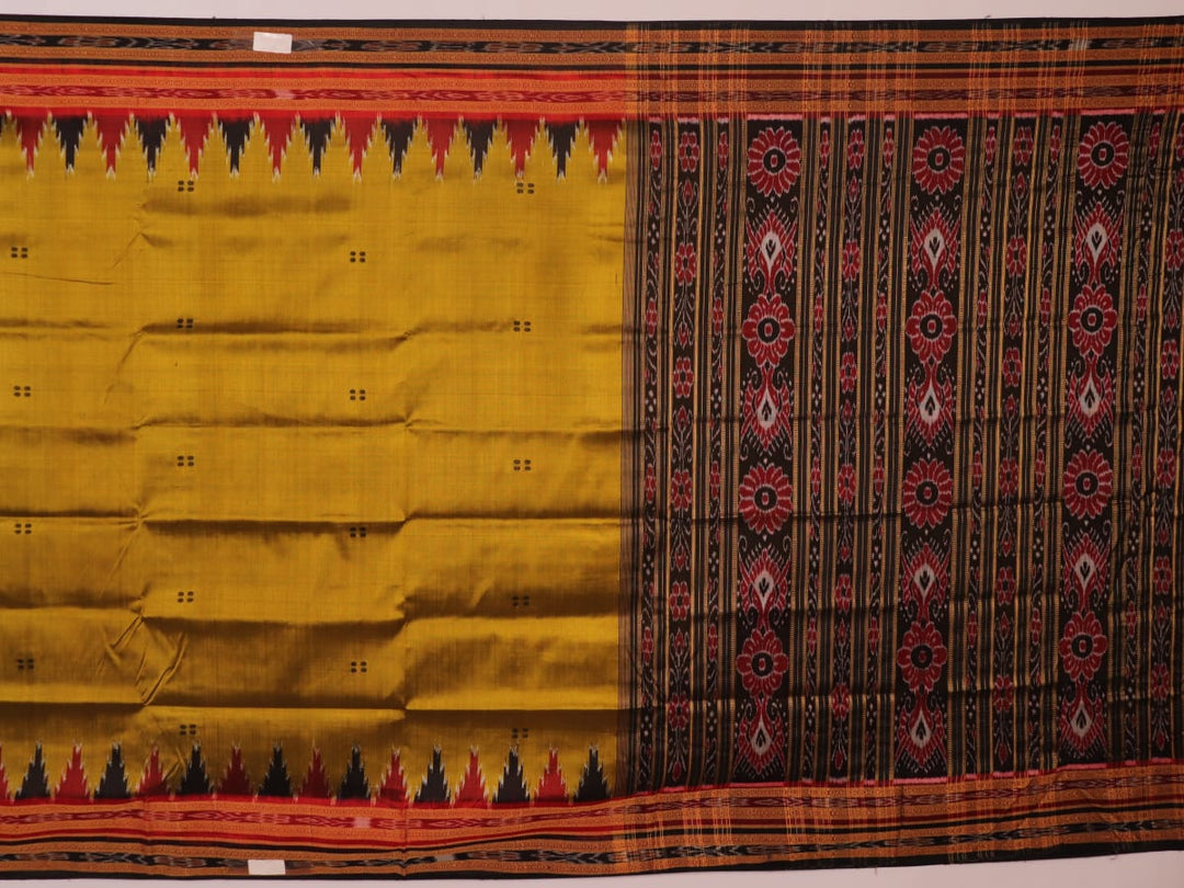 Green and black Khandua silk saree draped; showcasing its butta pattern and elegant fall.