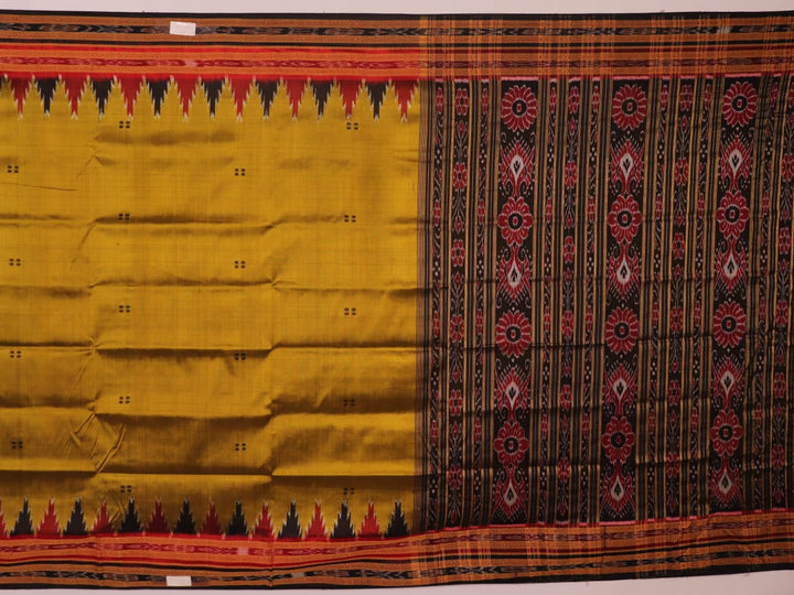 Green and black Khandua silk saree draped; showcasing its butta pattern and elegant fall.