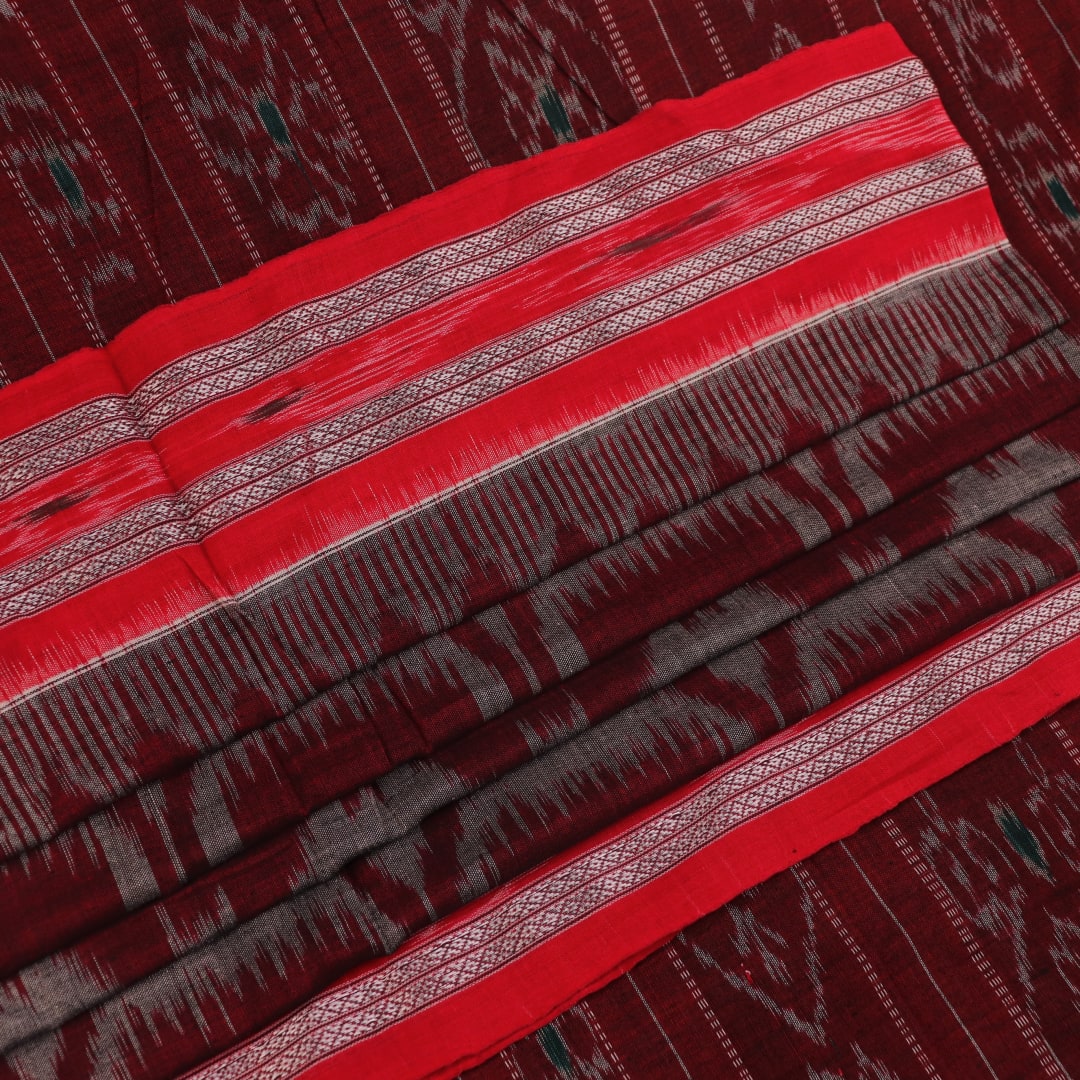 Grey and red Sambalpuri cotton saree draped to show its fall, style, and motif pattern.