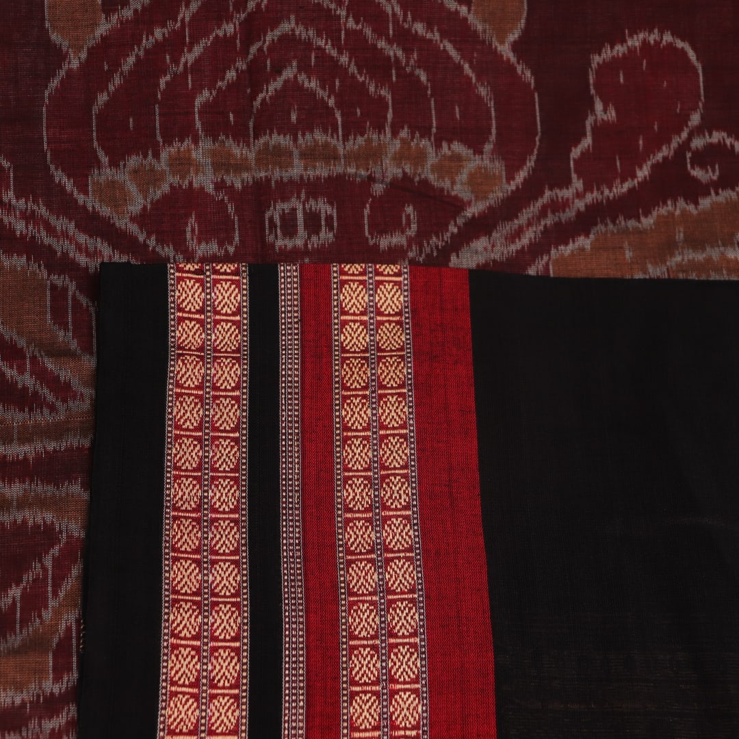 Full view of grey Bomkai cotton saree, featuring black border and butta pattern.