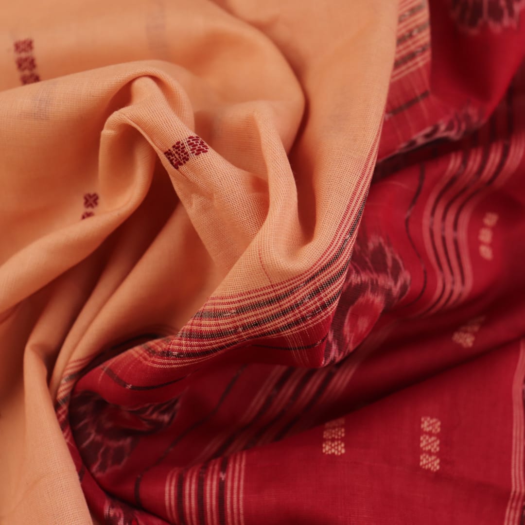 Full view of a cream and maroon Sambalpuri cotton saree with butta pattern.