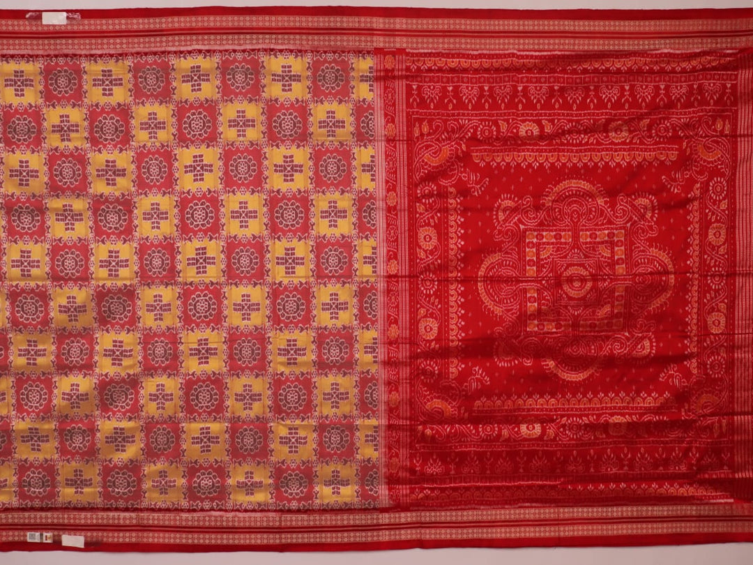 Close-up of multicolored silk Sambalpuri saree fabric showing intricate handloom weave texture.