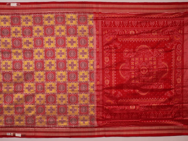 Close-up of multicolored silk Sambalpuri saree fabric showing intricate handloom weave texture.
