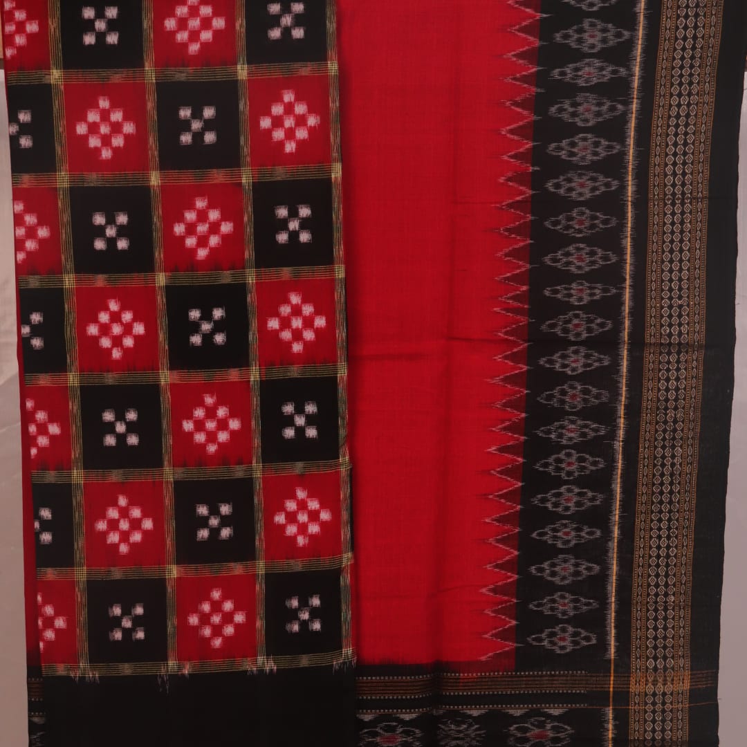 Detail of the black Sambalpuri cotton Pasapalli dress material's blouse piece with red accents.