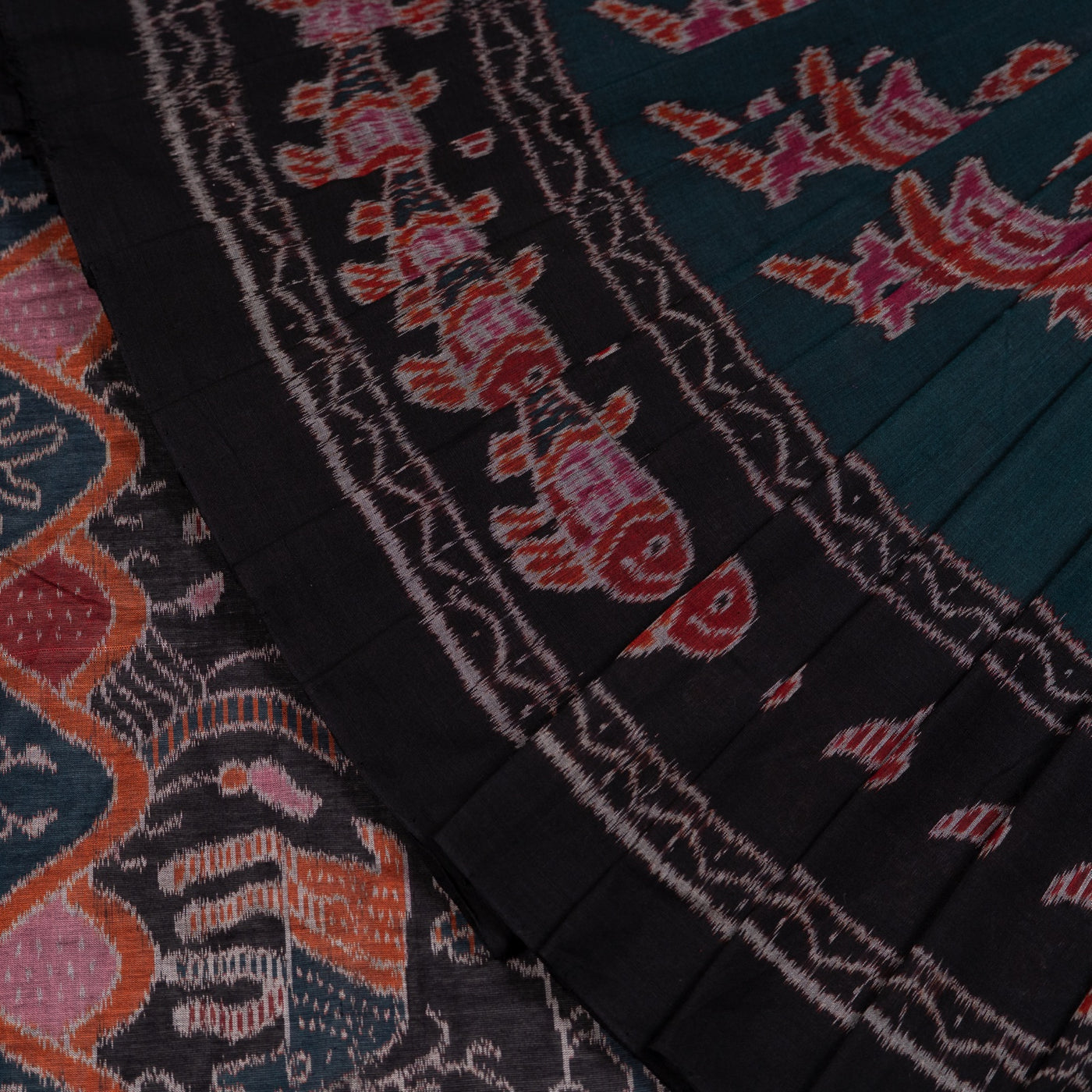Folded presentation of the Green and Black Sambalpuri cotton saree.
