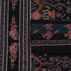 Detailed view of the handwoven motifs on the Green Sambalpuri cotton saree.