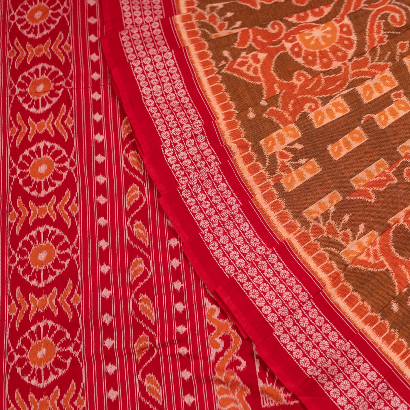 Folded presentation of the Brown and Red Sambalpuri cotton saree.