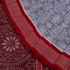 Folded presentation of the Grey and Red Sambalpuri cotton saree.