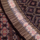 Folded presentation of the Brown and Brown Sambalpuri cotton saree.