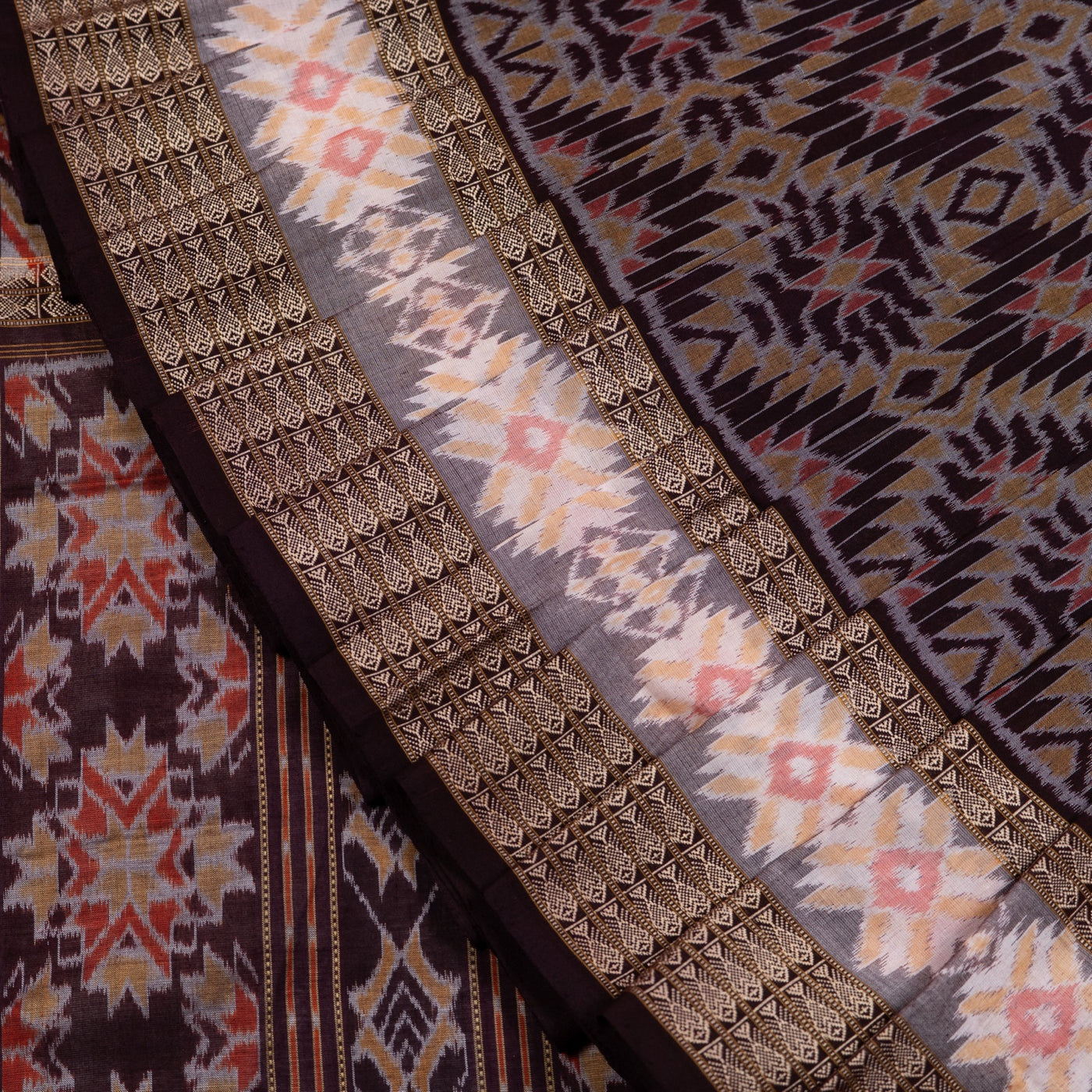Folded presentation of the Brown and Brown Sambalpuri cotton saree.