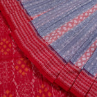Folded presentation of the Grey and Red Sambalpuri cotton saree.