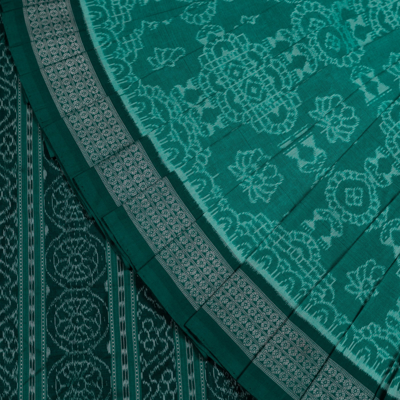 Folded presentation of the Green and Green Sambalpuri cotton saree.