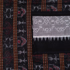 Detailed view of the handwoven motifs on the Grey Sambalpuri cotton saree.