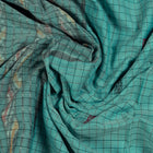 Draped view of the Green Sambalpuri cotton saree showing its handwoven texture and striped.