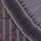 Folded presentation of the Grey and Black Sambalpuri cotton saree.