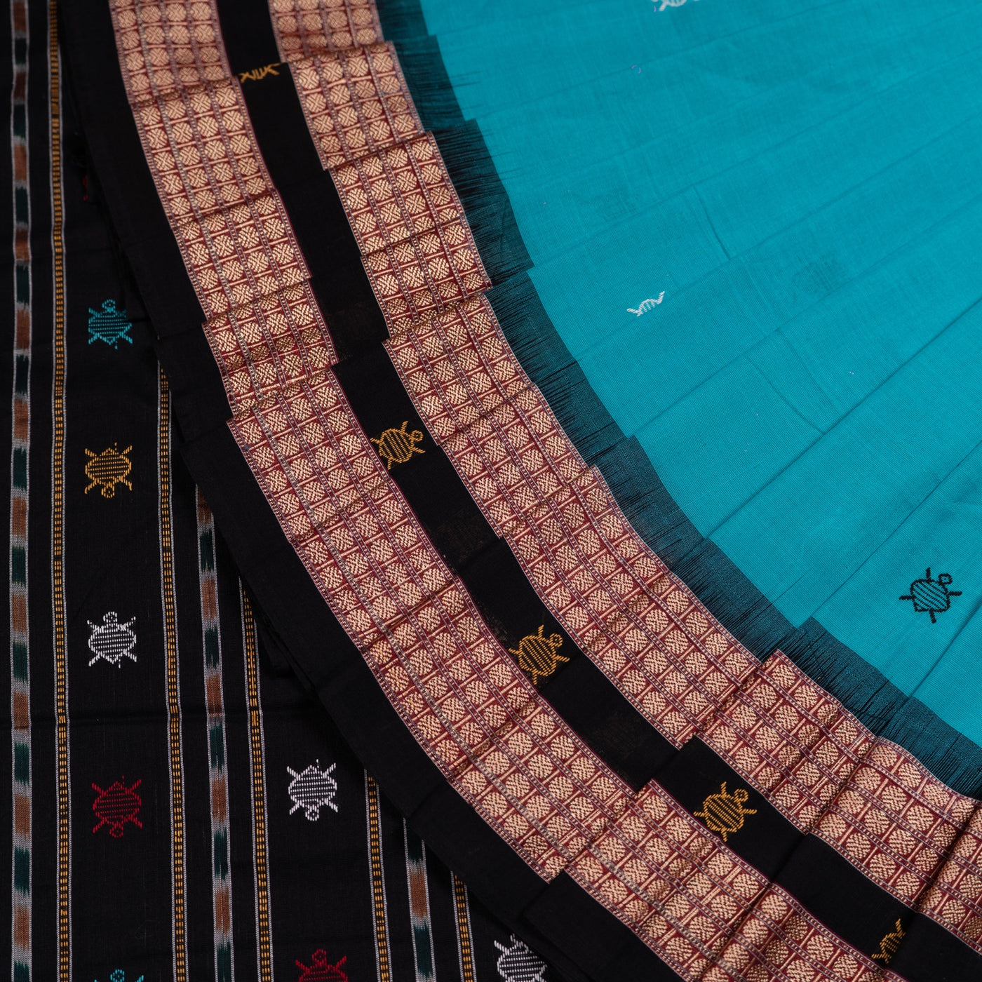 Folded presentation of the Green and Black Bomkai cotton saree.