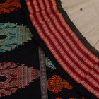Folded presentation of the Grey and Black Bomkai cotton saree.