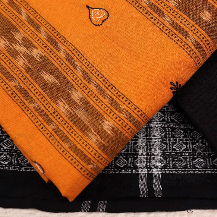 Close-up view of the blouse piece from a yellow and black cotton Sambalpuri dress material featuring motifs.