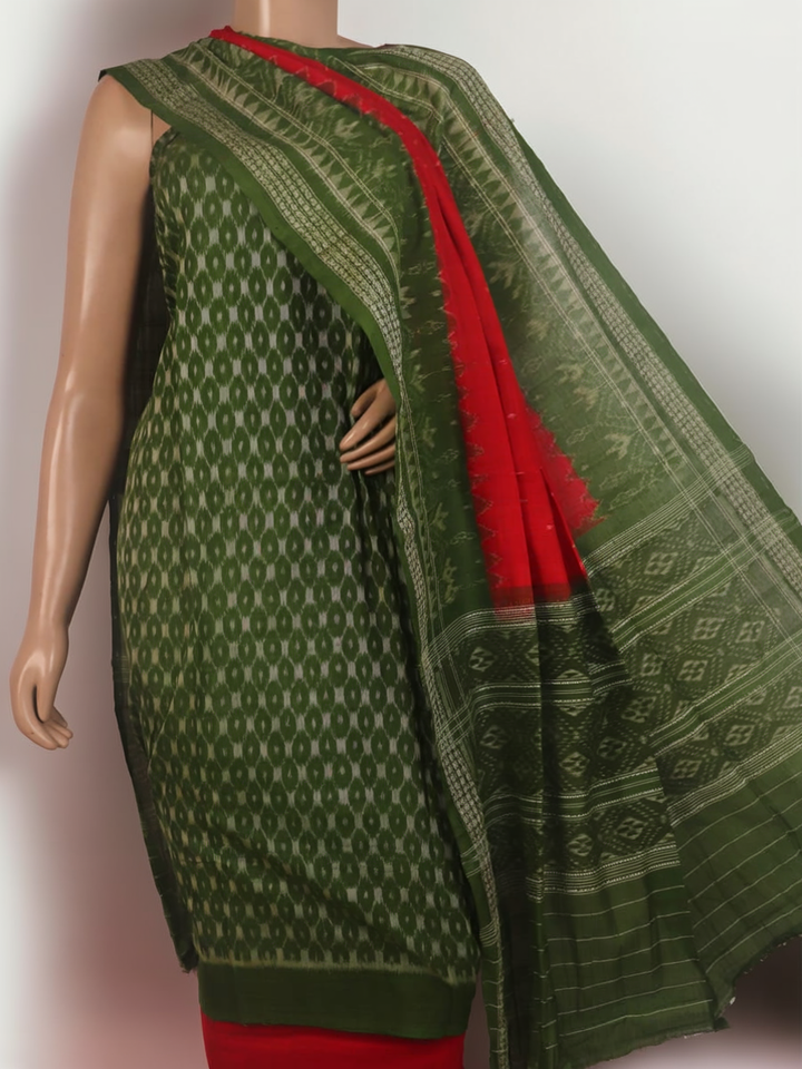 Close-up of the green Sambalpuri cotton dress material's blouse piece with red motifs.