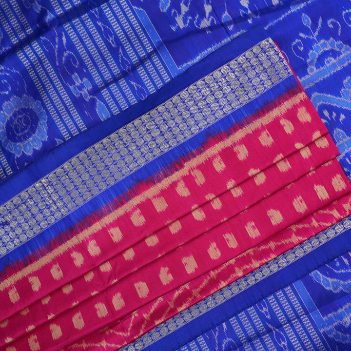 Close-up of Sambalpuri silk fabric texture, revealing the fine handloom weave and quality.