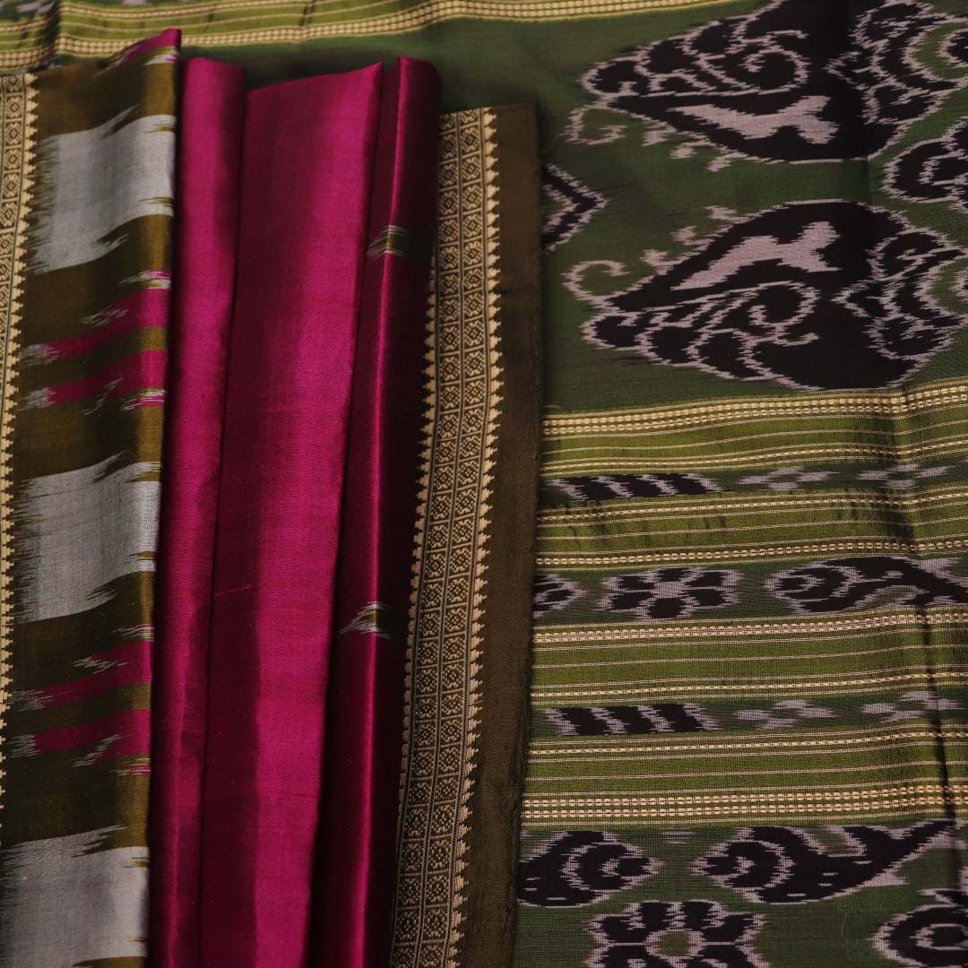 Magenta Khandua silk saree styled; green blouse accentuates the butta pattern and rich drape.