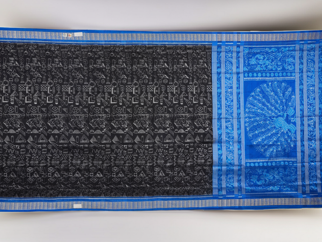 Close-up of Sambalpuri Silk saree fabric, revealing its rich texture and intricate black and blue weave.