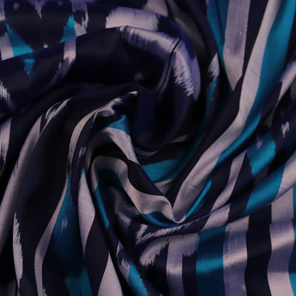 Royal blue Khandua silk saree with intricate motifs, draped elegantly for styling inspiration