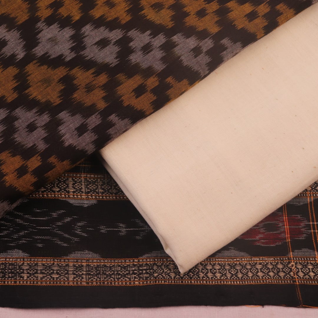 Detail of brown and white Sambalpuri cotton dress material blouse piece with motifs.