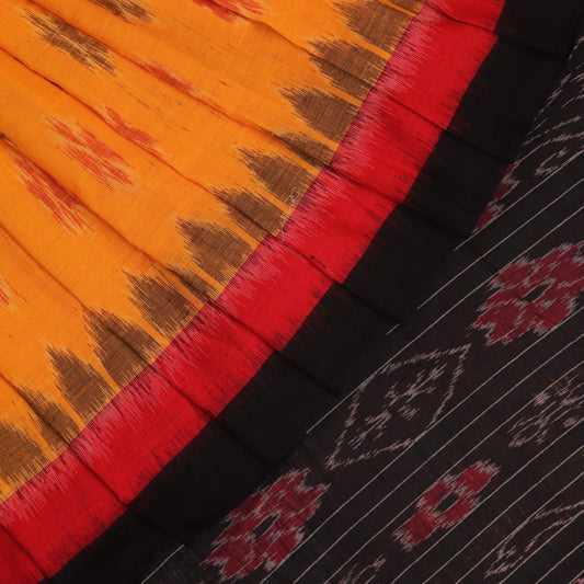 Styling shot showcasing a draped yellow and black Sambalpuri cotton saree with motif details.