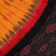 Styling shot showcasing a draped yellow and black Sambalpuri cotton saree with motif details.