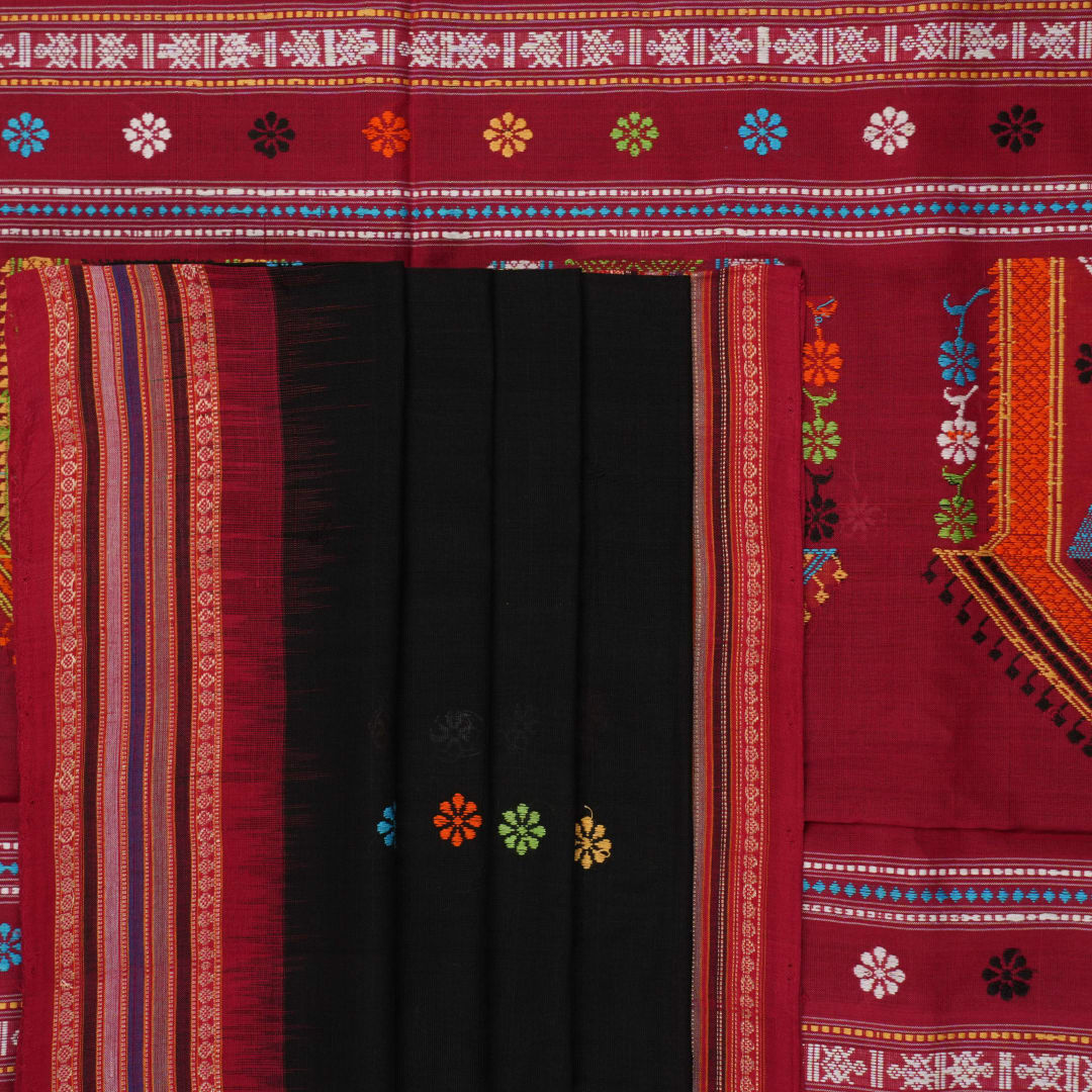 Full view of the black and red Dolabedi cotton saree laid out to show the complete pattern and pallu.