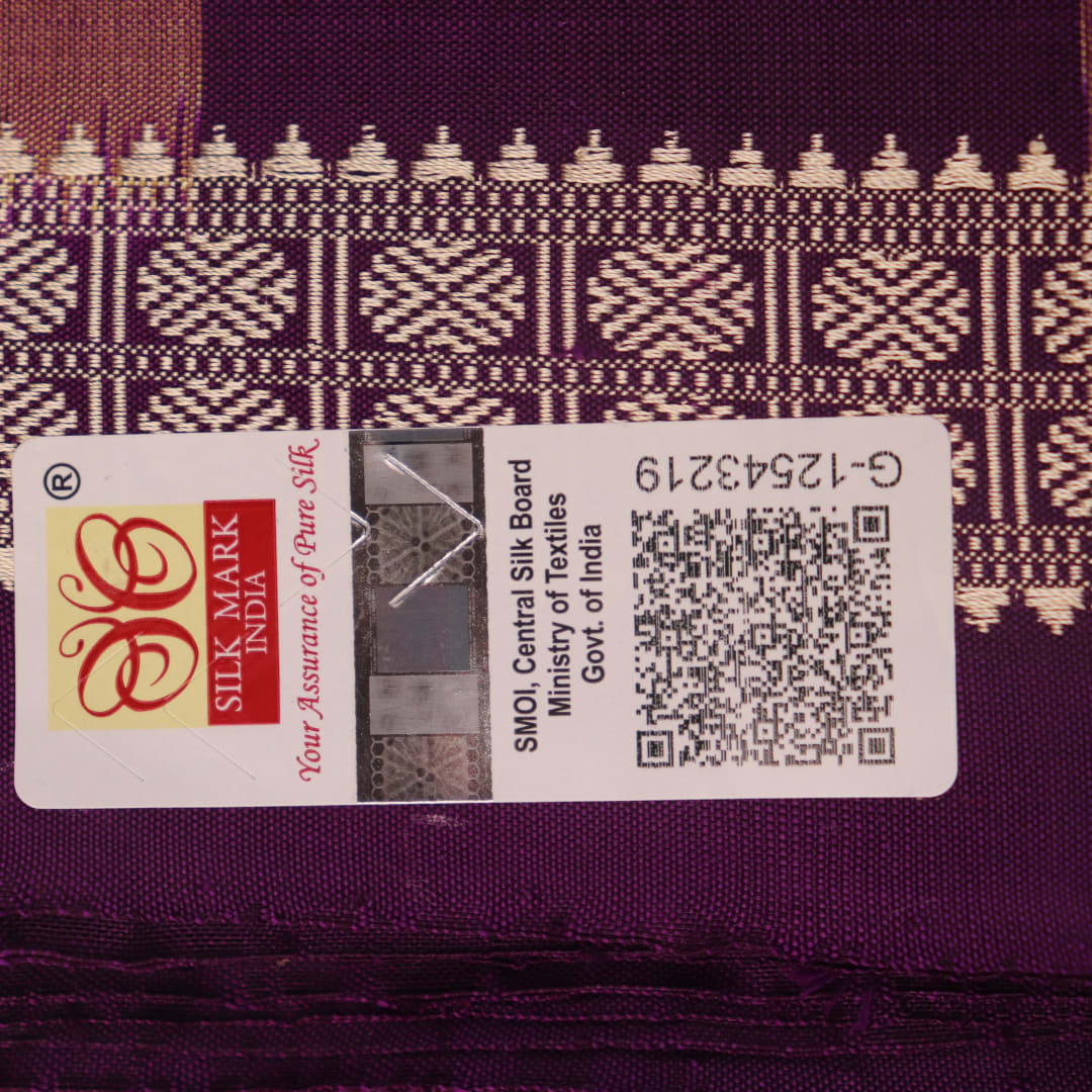 Close-up of the smooth, lustrous texture of multi-color and violet Bomkai silk saree, featuring butta weave.