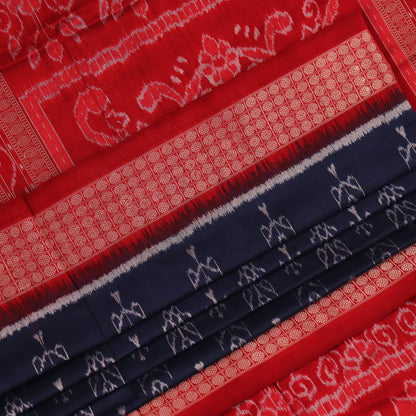 Close-up view of the blue silk Sambalpuri saree's fabric texture showcasing intricate motifs in red
