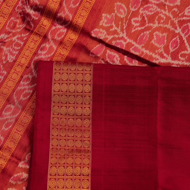 Close-up of luxurious green silk tissue saree fabric, showcasing intricate butta weaving details.