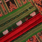Red and green Khandua silk saree draped, showcasing the overall look and fall.