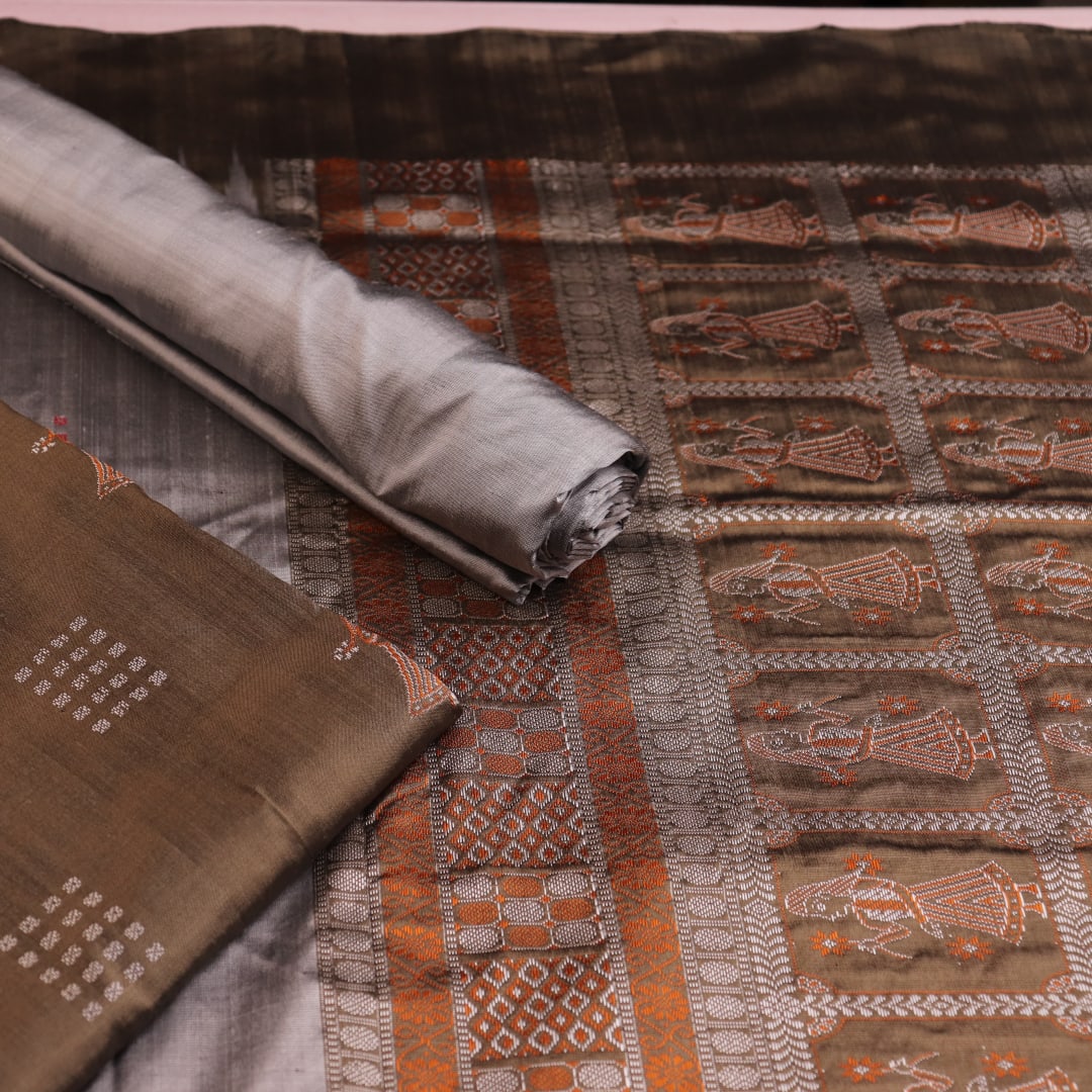 Detail of grey Bomkai silk blouse piece with butta pattern for dress material.