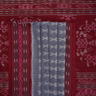 Elegant styling of a grey and maroon Sambalpuri cotton saree with hand-woven ikat motifs draped on a model.