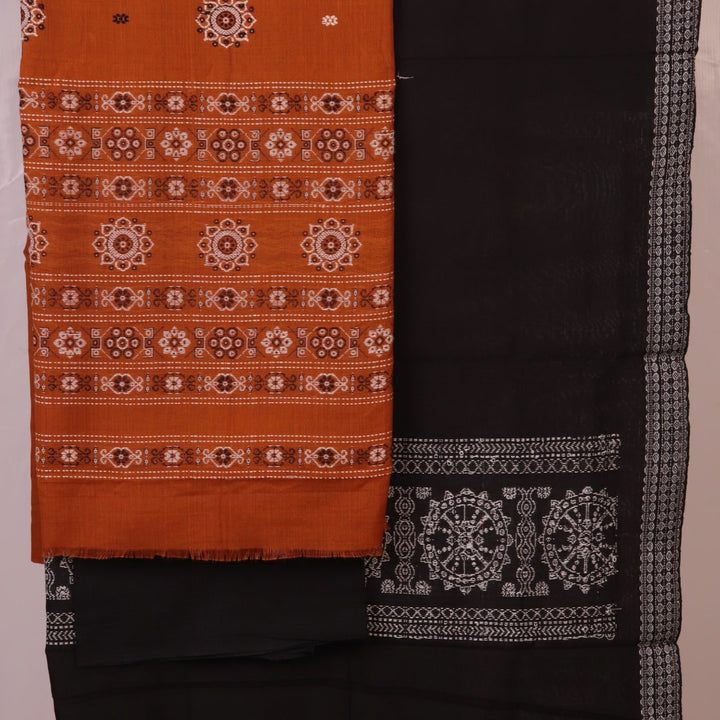 Detailed view of the black Bomkai cotton blouse piece, matching the yellow dress material.