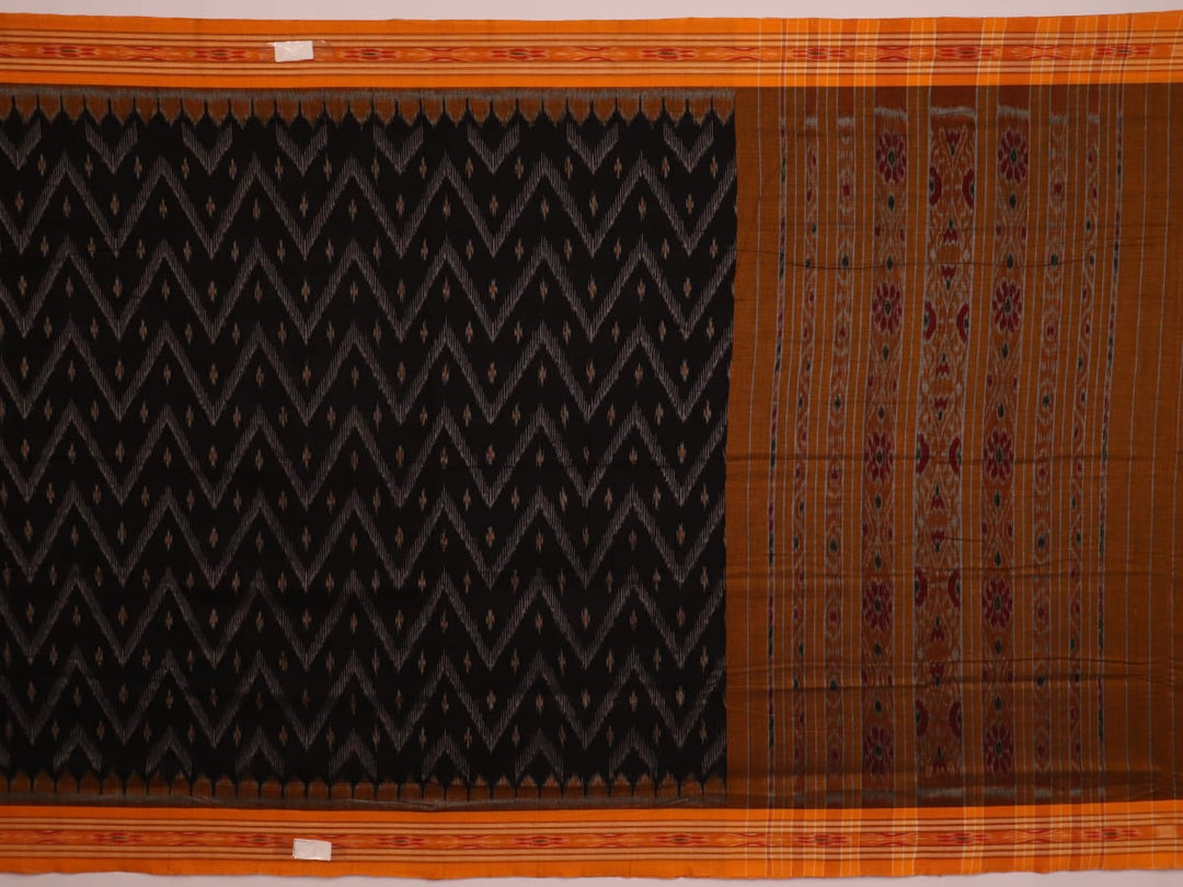 Black and yellow cotton Sambalpuri saree with motifs, styled and draped elegantly